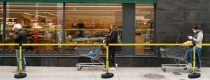 Supermarket  queuing with barrier