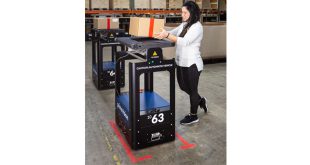 Warehouse staff and robots work hand in hand to meet demand