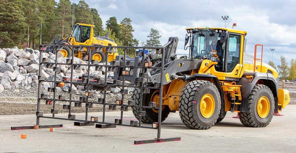 Competitors had to use a stick attached to the pallet forks on an L120H wheel loader to knock down 10 bricks